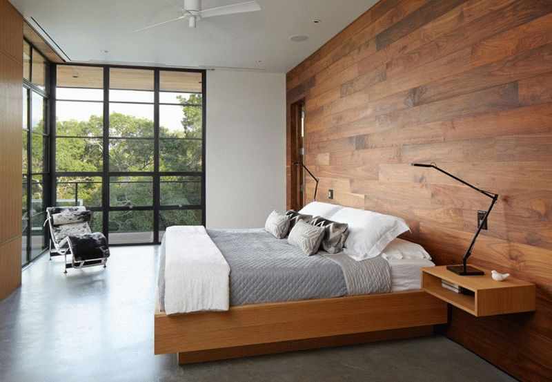 Наиболее часто ламинат в спальне используется для оформления стены у изголовья кровати